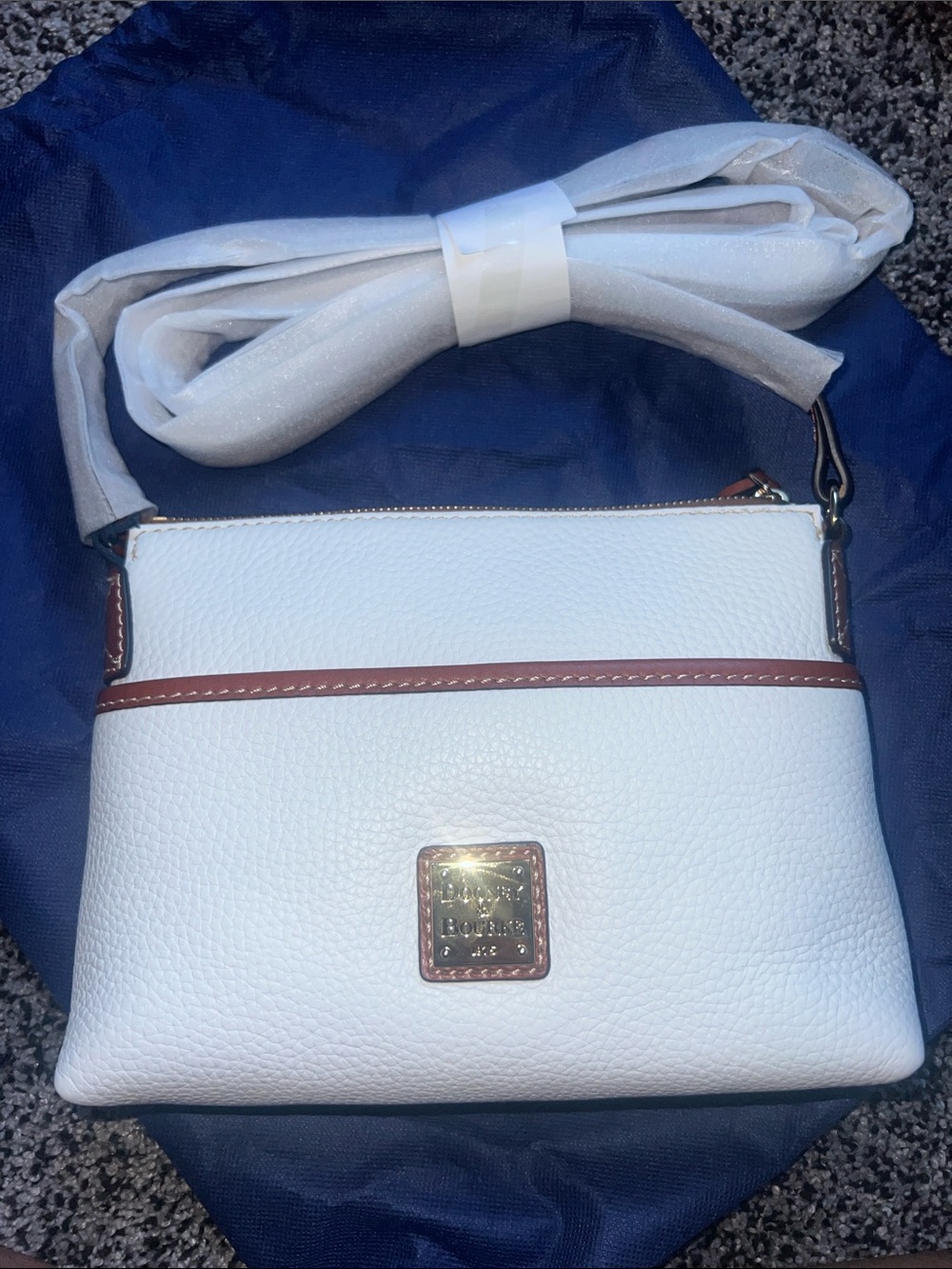 Dooney & Bourke White Leather Crossbody with Brown Trim and Gold Plaque